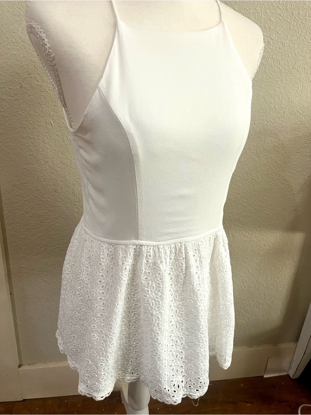 Doe & Rae  Sleeveless halter-style peplum top